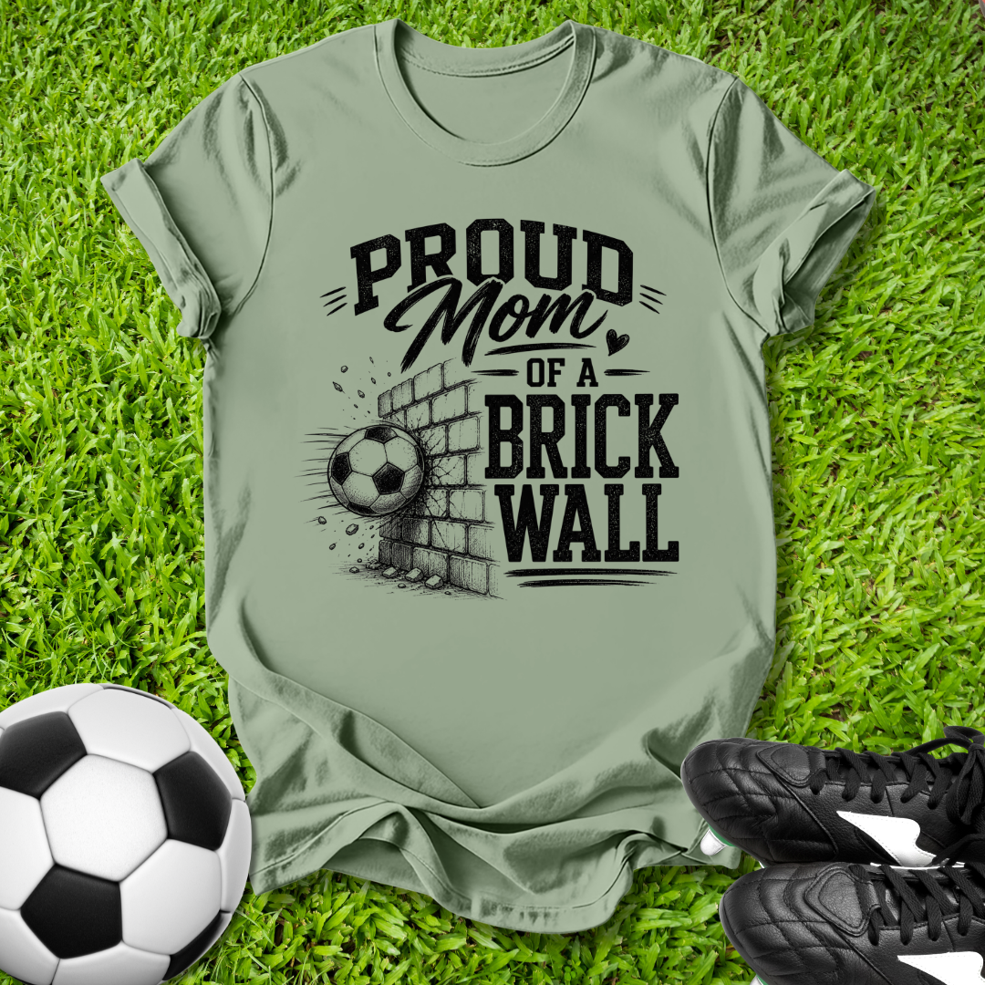 Green shirt with a soccer ball that says in white text Proud Soccer Mom of a Brick Wall