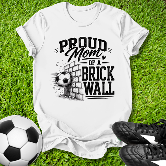 White shirt with a soccer ball that says in white text Proud Soccer Mom of a Brick Wall