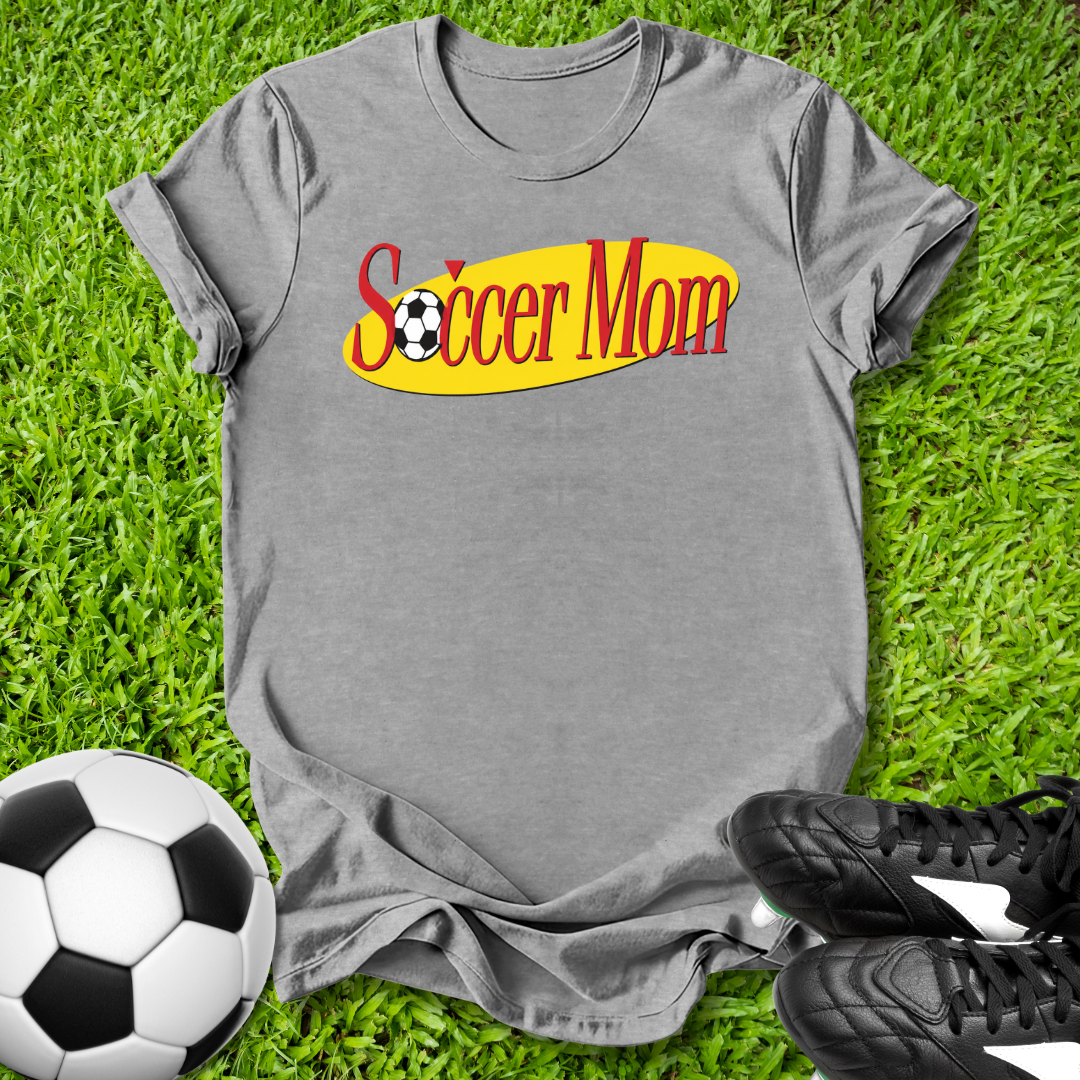 Gray t-shirt with 'Soccer Mom' text on grass with soccer ball and shoes