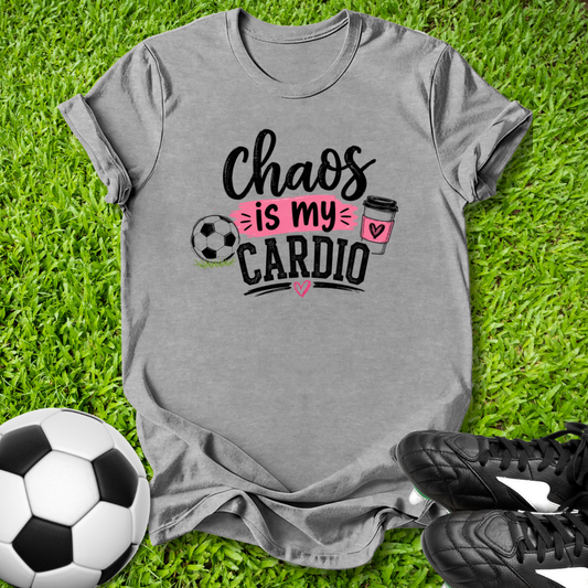 Gray t-shirt with 'Chaos is my Cardio' design on grass with soccer ball and shoes