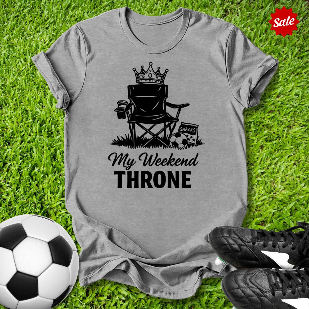 Gray t-shirt with 'My Weekend Throne' graphic on grass with soccer ball and shoes
