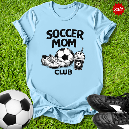 Blue Pink t-shirt with 'Soccer Mom Club' text on grass with soccer ball and shoes