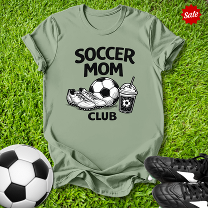 GreenPink t-shirt with 'Soccer Mom Club' text on grass with soccer ball and shoes