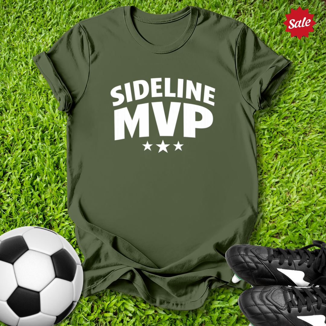 Green t-shirt with 'Sideline MVP' text on grass with soccer ball and shoes
