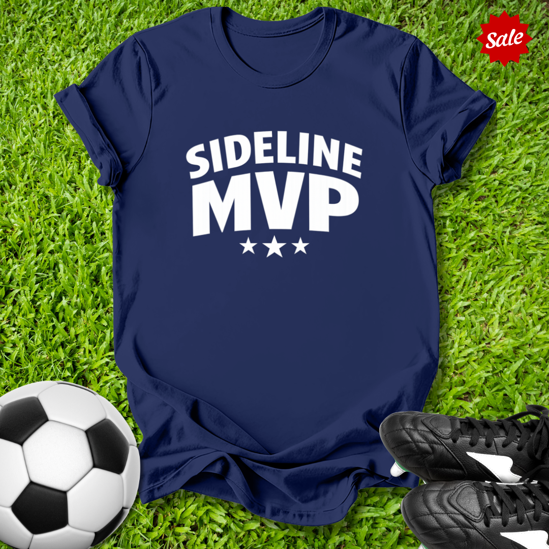 Navy blue t-shirt with 'Sideline MVP' text on grass with soccer ball and shoes