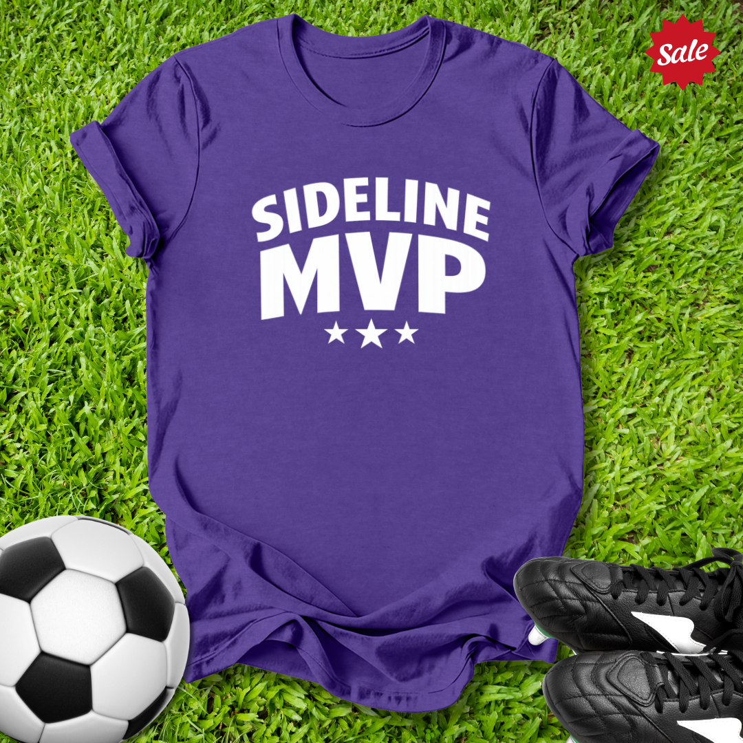 Purple t-shirt with 'Sideline MVP' text on grass with soccer ball and shoes