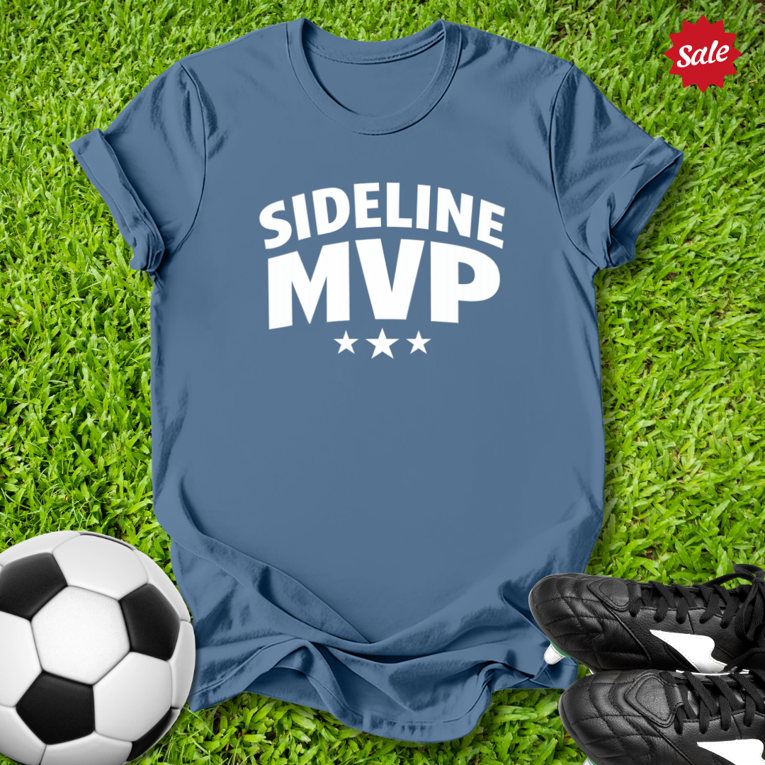 Blue t-shirt with 'Sideline MVP' text on grass with soccer ball and shoes