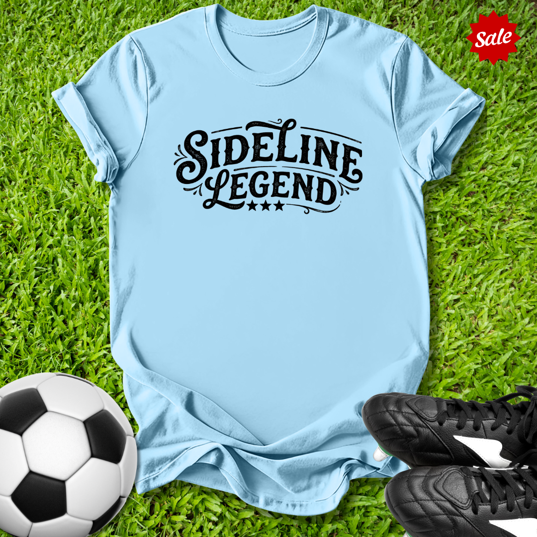 Light blue t-shirt with 'Sideline Legend' text on grass with soccer ball and shoes