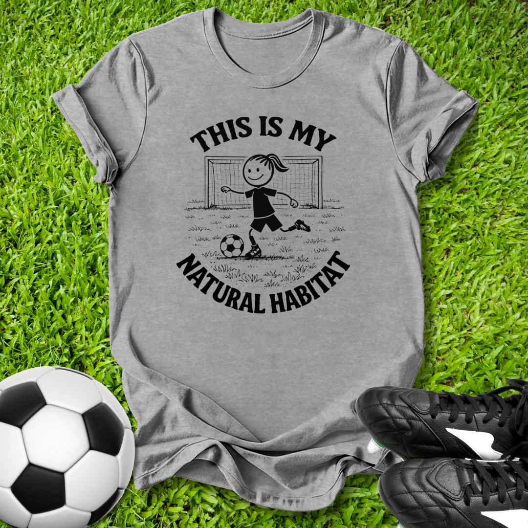 Gray t-shirt with soccer-themed  this is my natural habitat graphic on grass with soccer ball and shoes