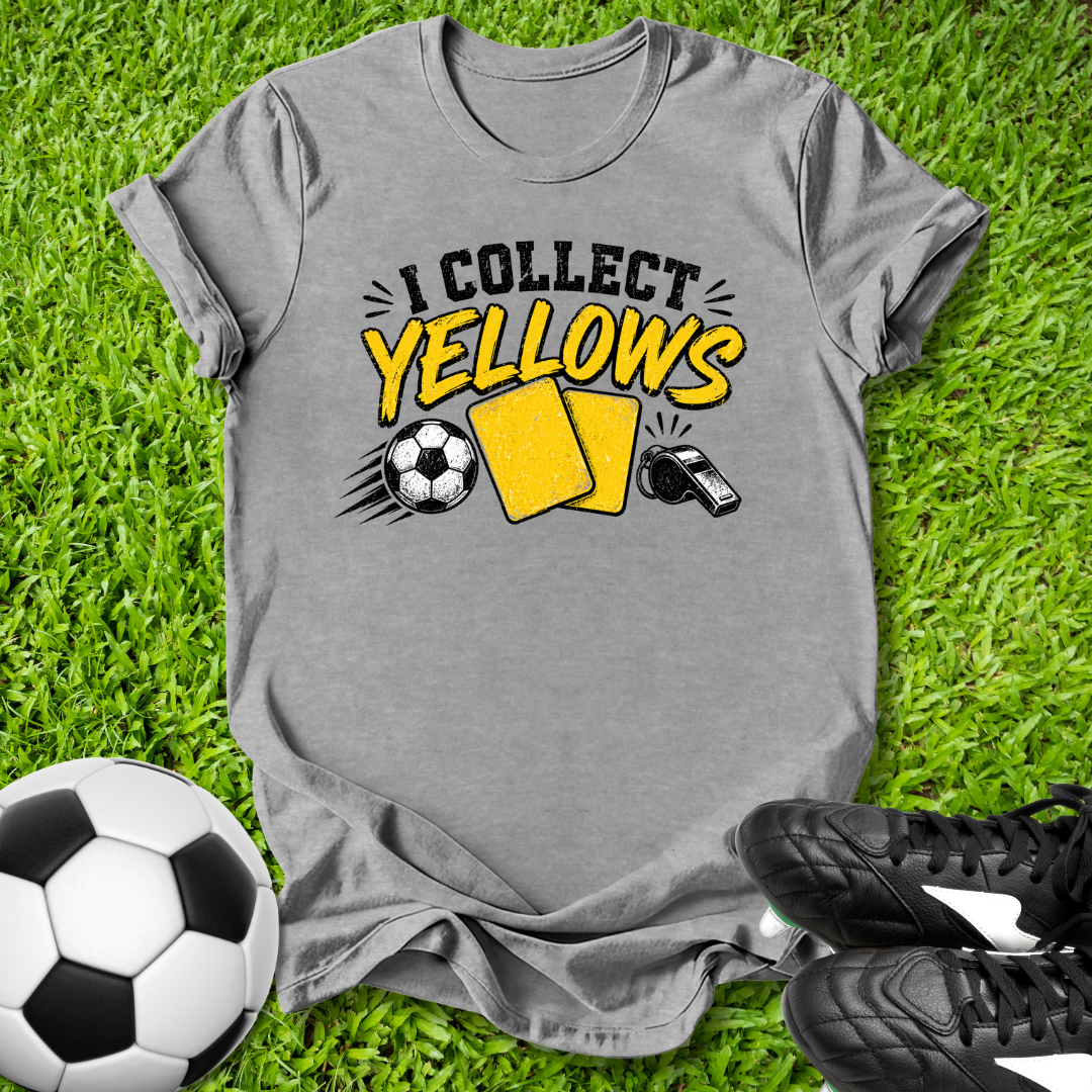 Gray t-shirt with 'I Collect yellows' design on grass with soccer ball and shoes.