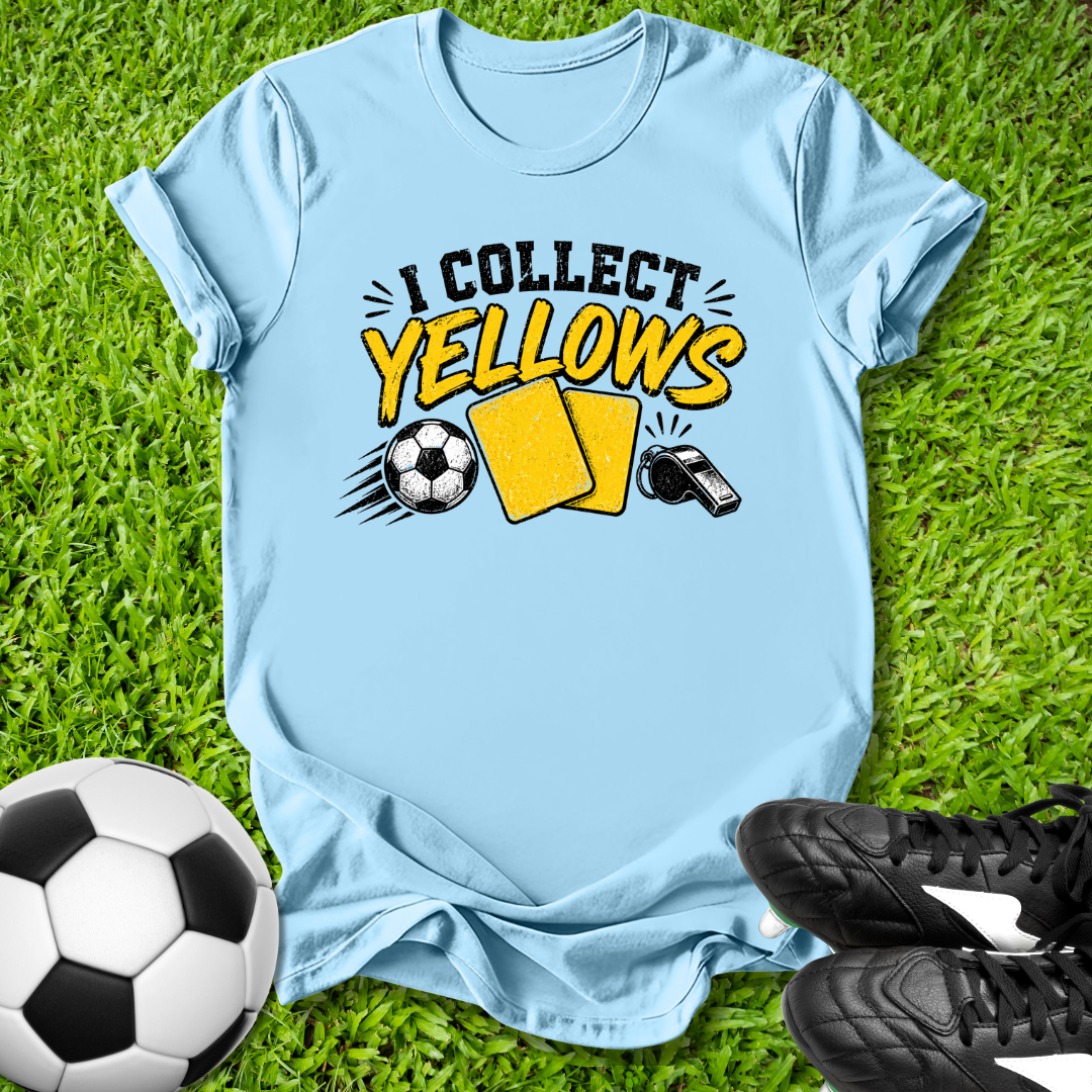 Light blue t-shirt with 'I Collect yellows' text and soccer ball graphics on grass with soccer ball and shoes.