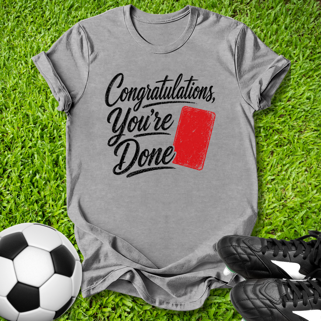 Gray t-shirt with 'Congratulations, You're Done' text on grass with soccer ball and shoes.