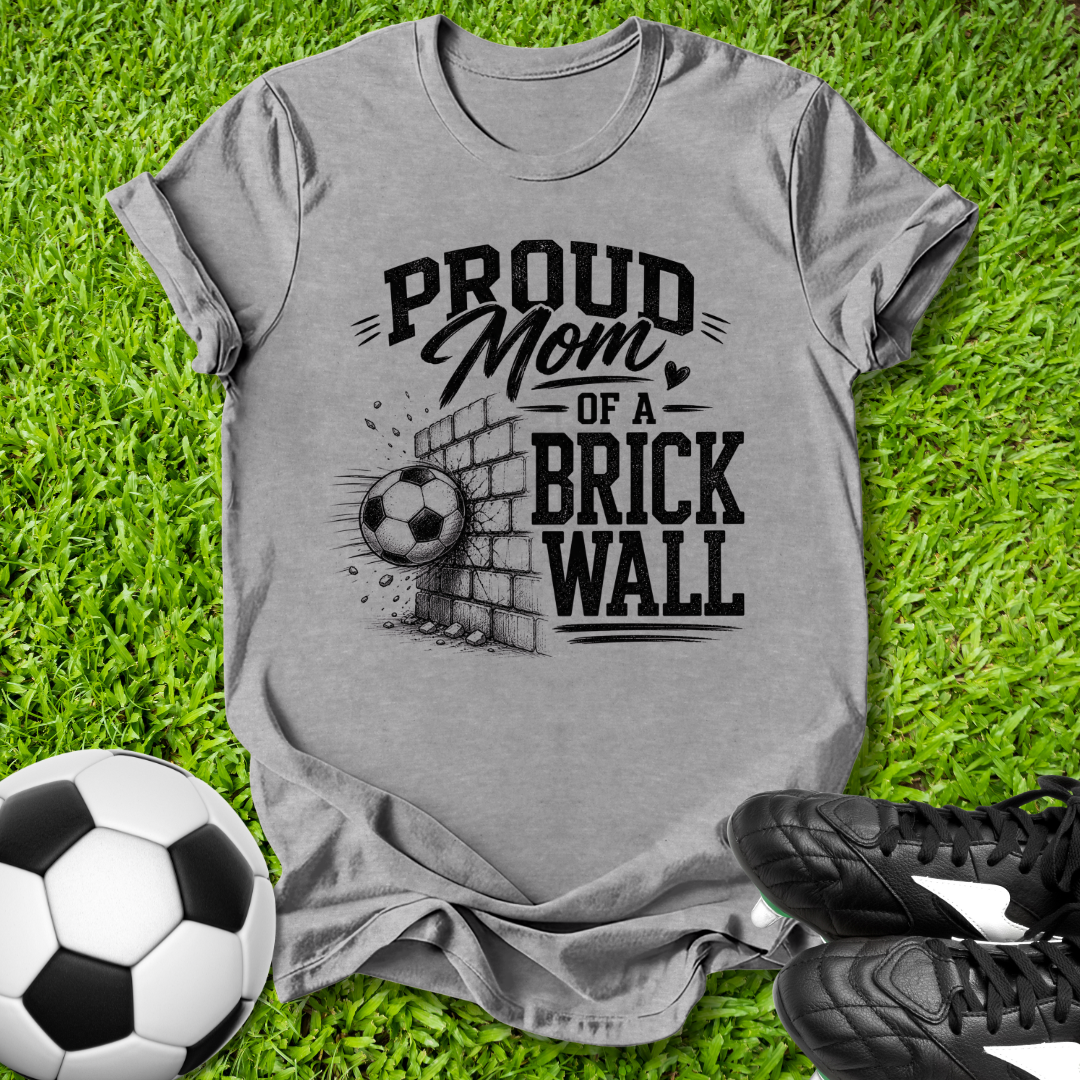 Gray shirt with a soccer ball that says in white text Proud Soccer Mom of a Brick Wall
