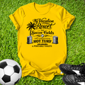 Yellow t-shirt with a humorous soccer field graphic on grass with a soccer ball and shoes.