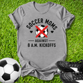 Gray t-shirt with soccer mom design on grass with soccer ball and cleats