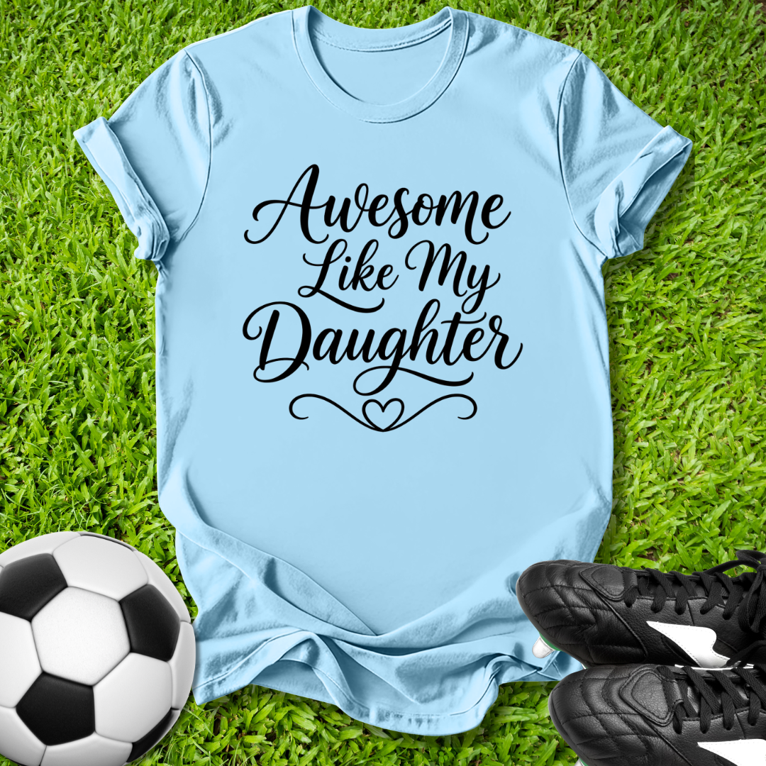 Light blue t-shirt with 'Awesome Like My Daughter' text on grass with soccer ball and shoes.