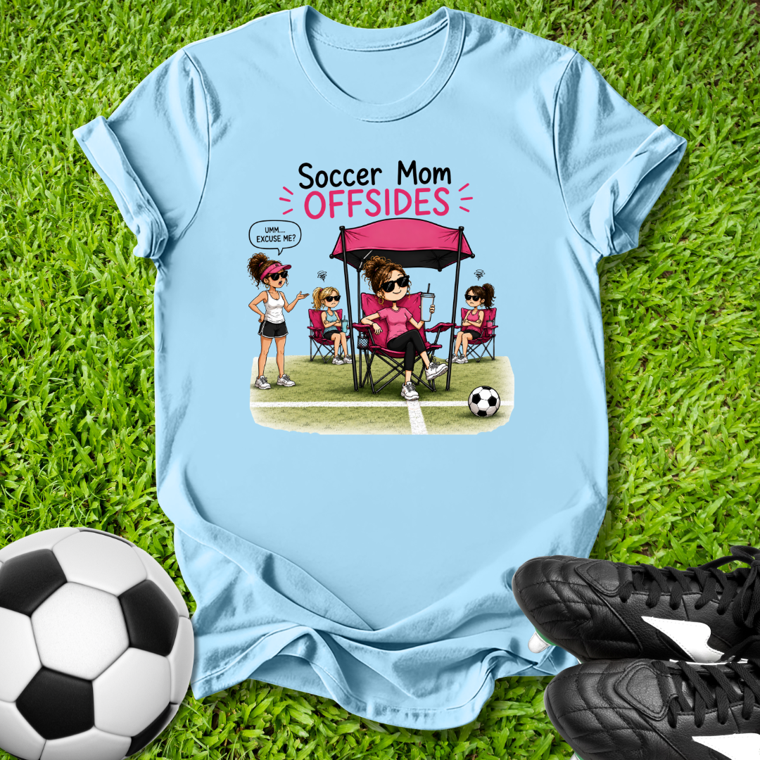 Light blue t-shirt with 'Soccer Mom OFFSIDES' graphic on grass with soccer ball and shoes.