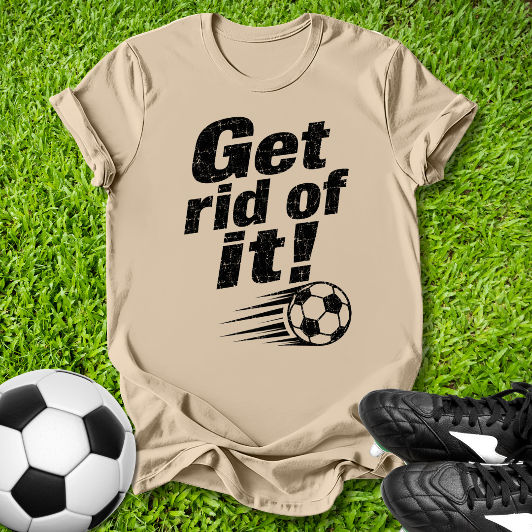 Beige t-shirt with 'Get rid of it!' text and soccer ball graphic on grass with soccer ball and shoes.