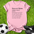 Pink t-shirt with 'Soccer Mom' definition on grass with soccer ball and shoes