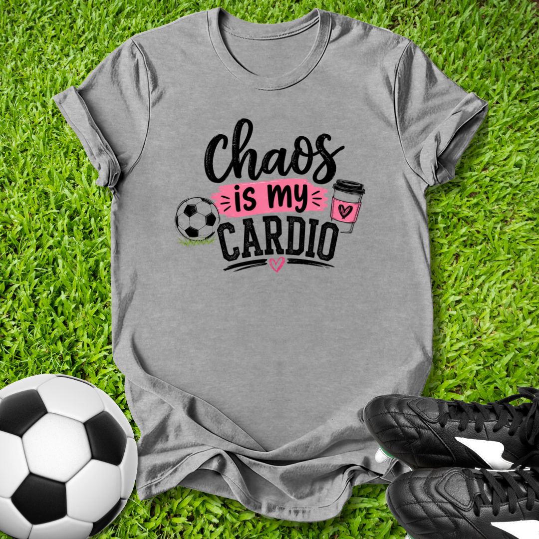 Gray t-shirt with 'Chaos is my Cardio' design on grass with soccer ball and shoes