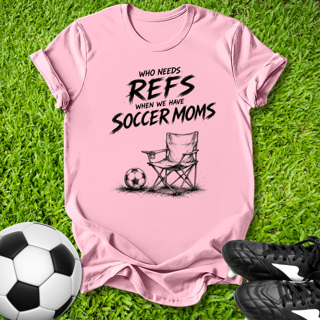 Pink t-shirt with soccer mom graphic on grass with soccer ball and shoes