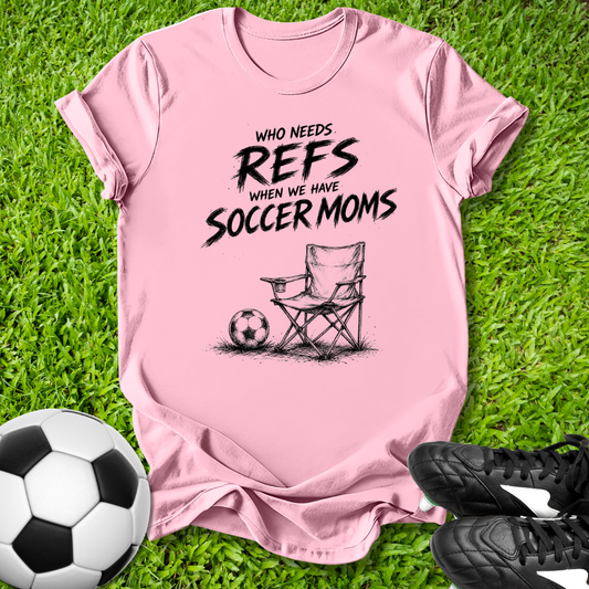 Pink t-shirt with soccer mom graphic on grass with soccer ball and shoes