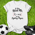 White t-shirt with a humorous physics joke on grass with soccer ball and shoes