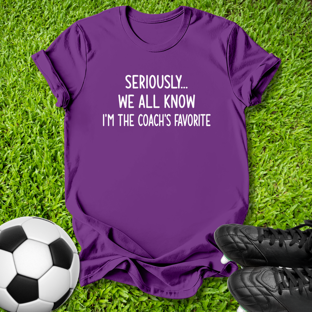 A purple short-sleeve t-shirt with white text reading 'SERIOUSLY.