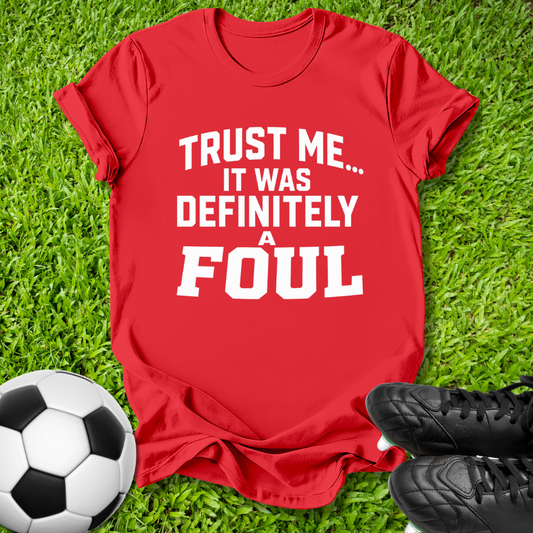 A red short-sleeve t-shirt with bold white text reading 'TRUST ME.