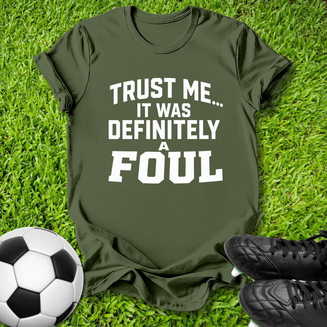 An olive green graphic t-shirt with the text 'TRUST ME.